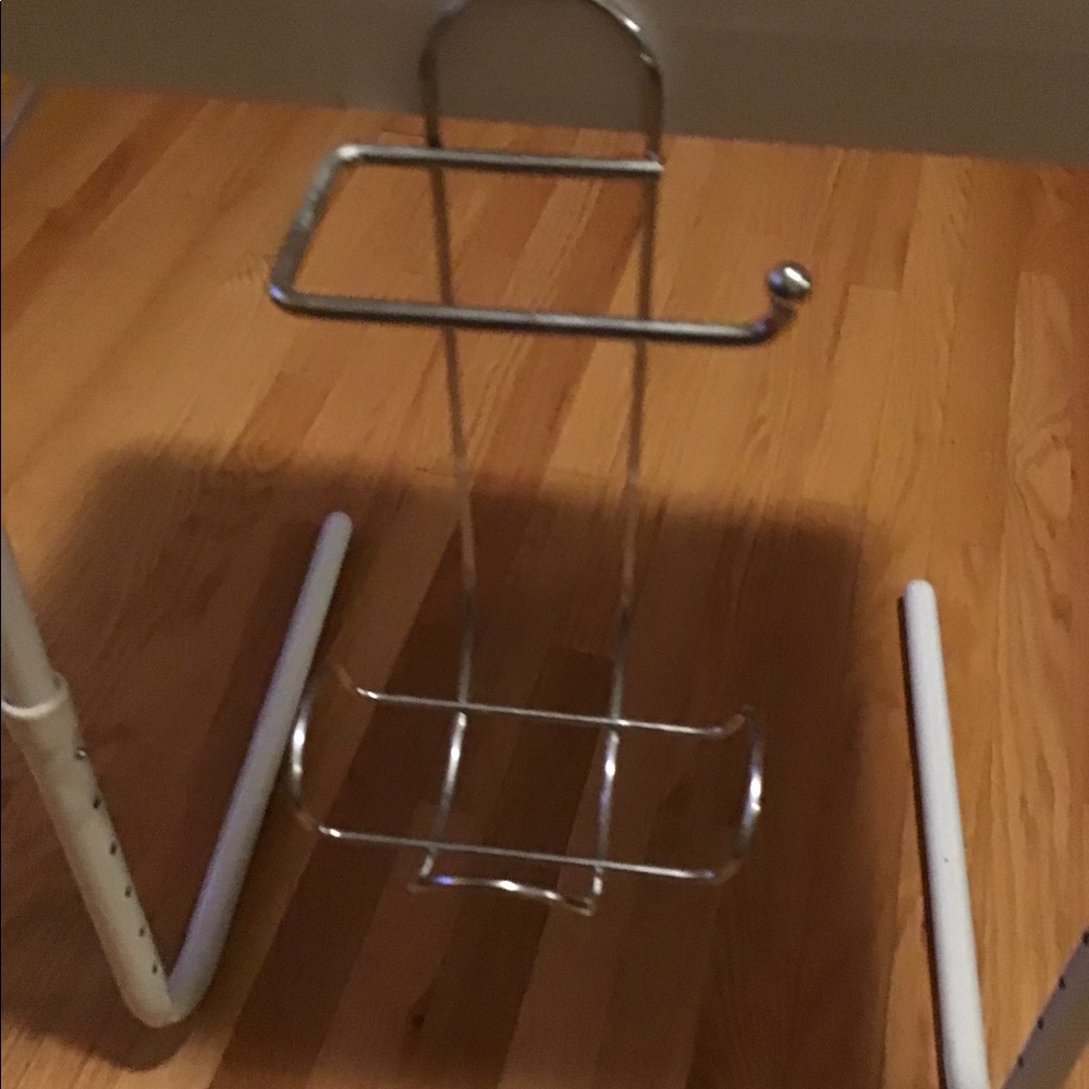 Over the shower rod hanger. In great condition